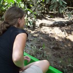 That’s me checking out a caiman (like a crocodile) on a Costa Rica riverbank. The boat driver drifted just a little closer than this, and then the caiman jumped into the water (causing me to jump about a mile, too!).